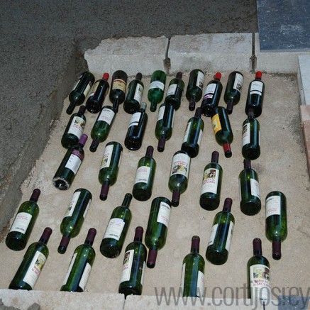 2- The base of the oven filled with bottles and then filled with saw dust and sand