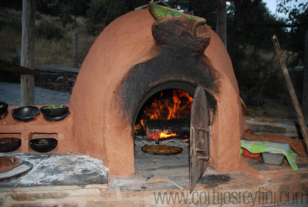 Pizza cooking in the clay oven